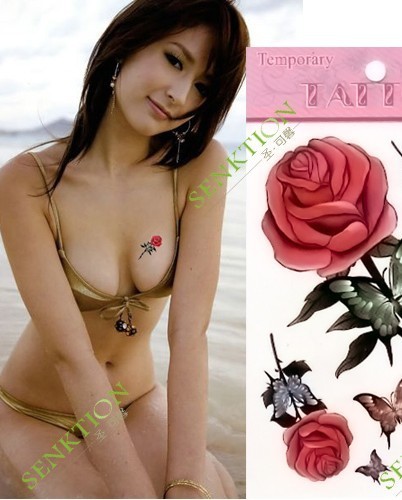 点击大图看下一张：火辣美女胸部红玫瑰纹身图案