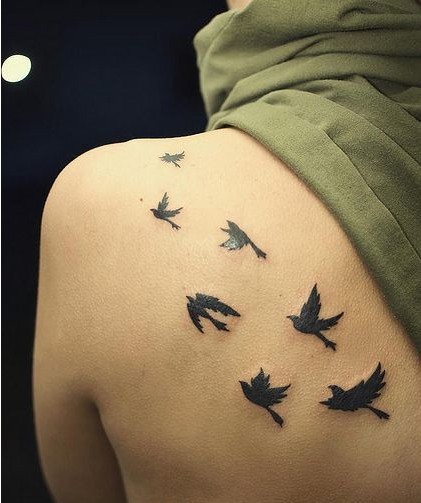 点击大图看下一张：最近比较流行的一群小鸽子纹身