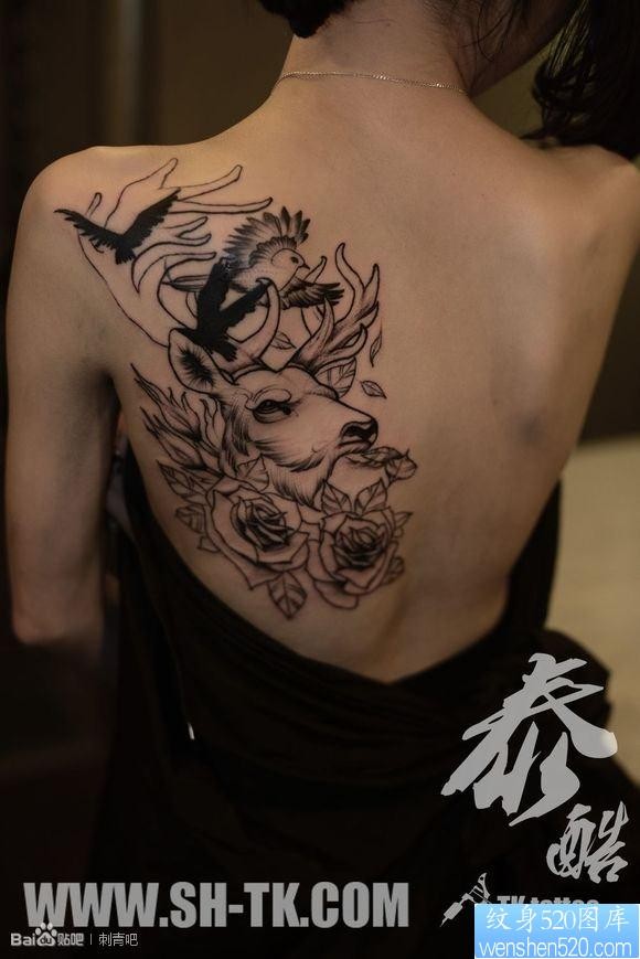点击大图看下一张：背部独角兽大雁玫瑰花纹身图片