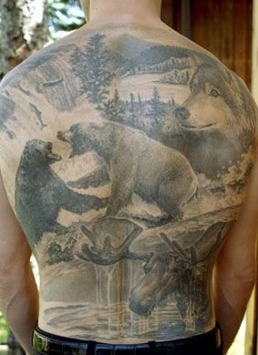 点击大图看下一张：狗熊森林和狼纹身图案凸显另类的纹身风格图案