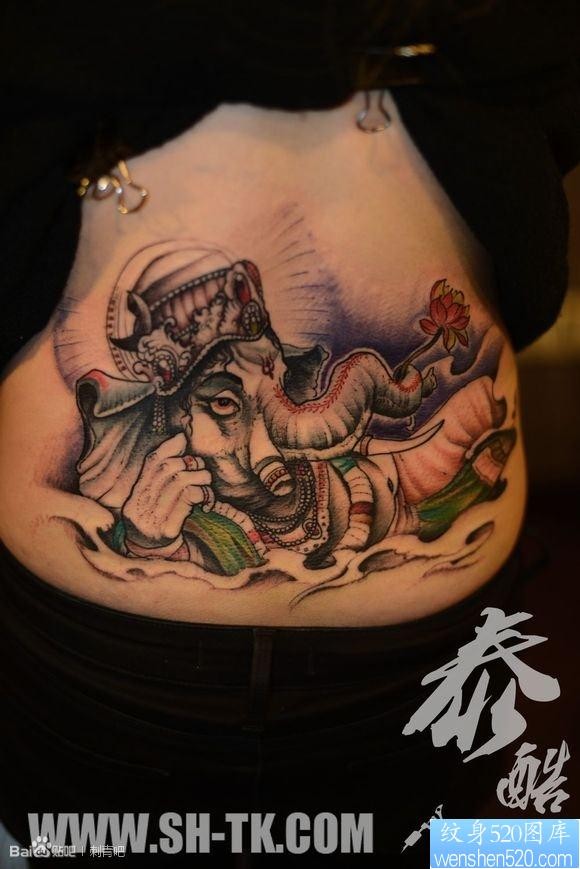 点击大图看下一张：腰部佛光睡财神之象纹身图片