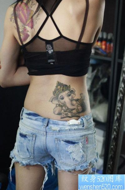 点击大图看下一张：纹身520图库推荐一幅女人侧腰象神纹身图片
