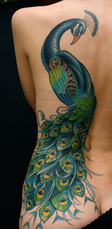 点击大图看下一张：腰部漂亮的花孔雀纹身