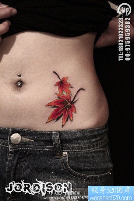 点击大图看下一张：女人腹部唯美时尚的枫叶纹身图片