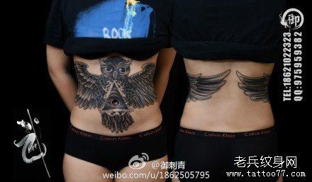 点击大图看下一张：女人腹部超帅潮流的猫头鹰纹身图片
