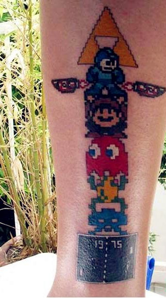点击大图看下一张：手臂上可爱的游戏人物纹身
