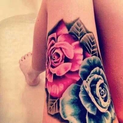 点击大图看下一张：腿部妖艳的玫瑰纹身