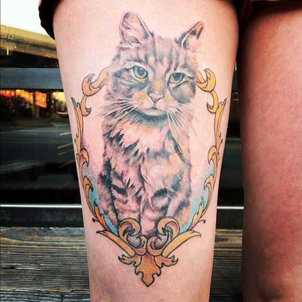 点击大图看下一张：大腿部可爱的猫咪纹身