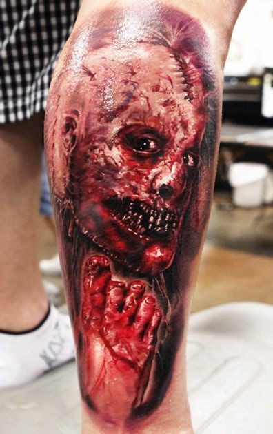 点击大图看下一张：腿部恐怖的恶魔纹身