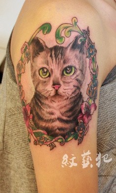 点击大图看下一张：超惹人爱猫咪纹身图