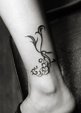 点击大图看下一张：腿部好看的图腾凤凰纹身图片