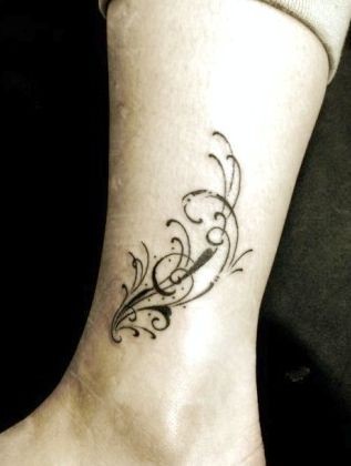 点击大图看下一张：女孩子腿部图腾藤蔓纹身图片