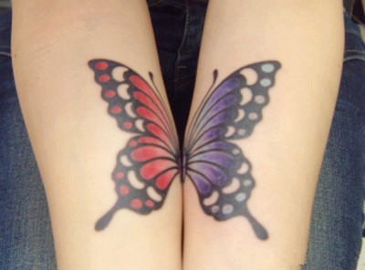点击大图看下一张：女性手臂蝴蝶刺青