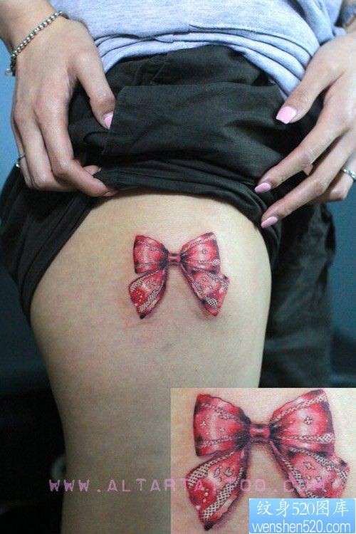 点击大图看下一张：女人大腿处好看流行的蝴蝶结纹身图片