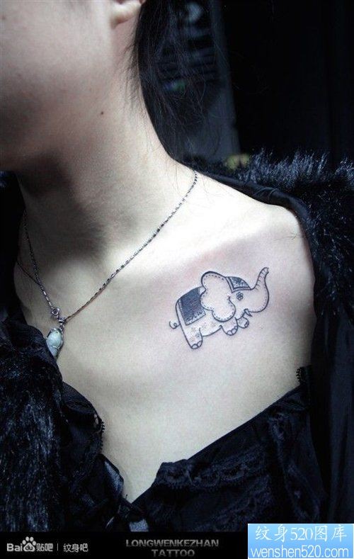 点击大图看下一张：女人胸前小巧可爱的小象纹身图片