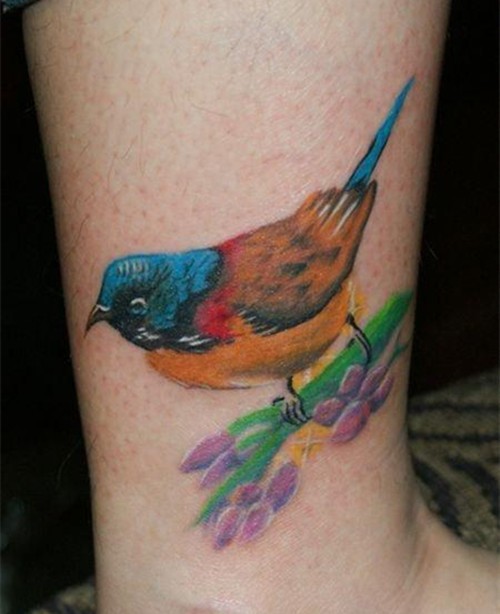 点击大图看下一张：唯美的小鸟腿部纹身图2