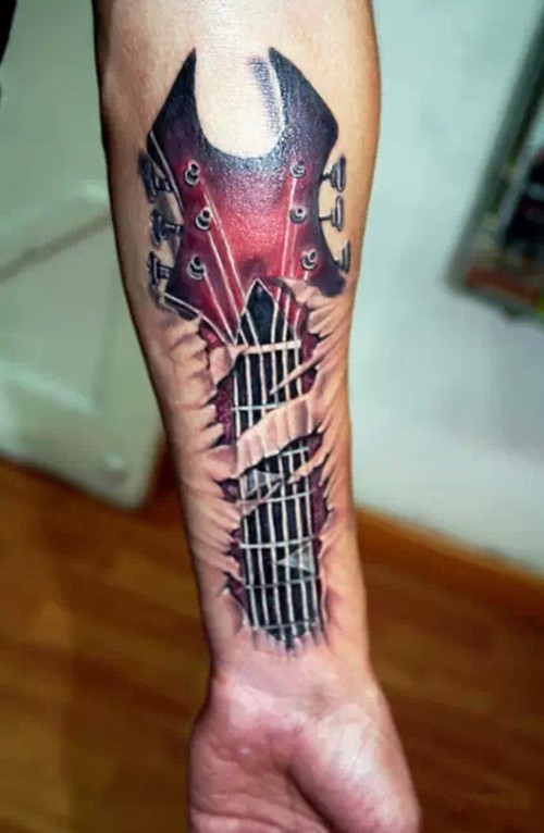 点击大图看下一张：一组逼真的手臂吉他纹身图3