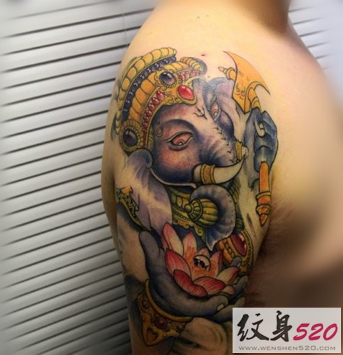点击大图看下一张：男性大臂传统象神纹身