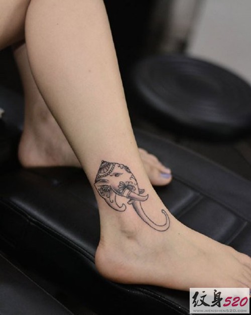 点击大图看下一张：女性小腿象神纹身