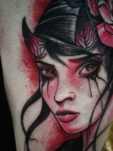 邪恶的女肖像大臂纹身图片