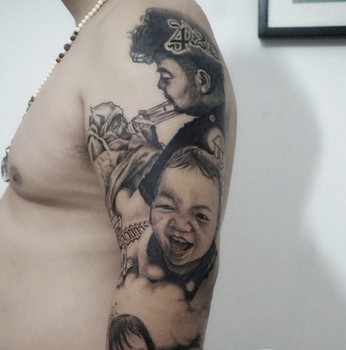 点击大图看下一张：非常有父爱的男士用纹身来纪念幸福时刻(1/4)