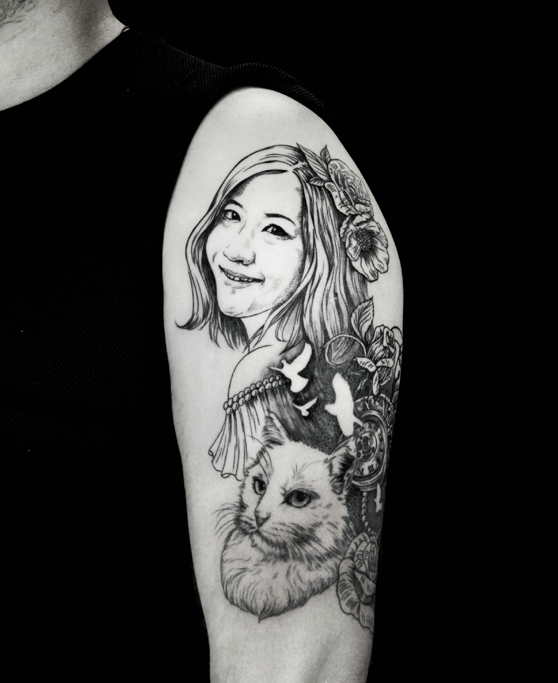 点击大图看下一张：大臂一款美女肖像和小猫一起的纹身(3/3)