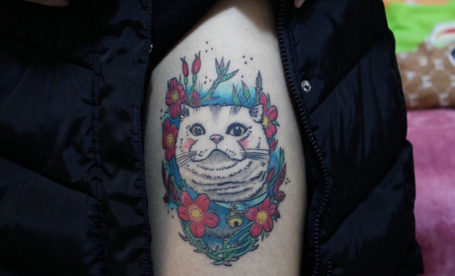 点击大图看下一张：花色喵星人的个性图案纹身(2/2)