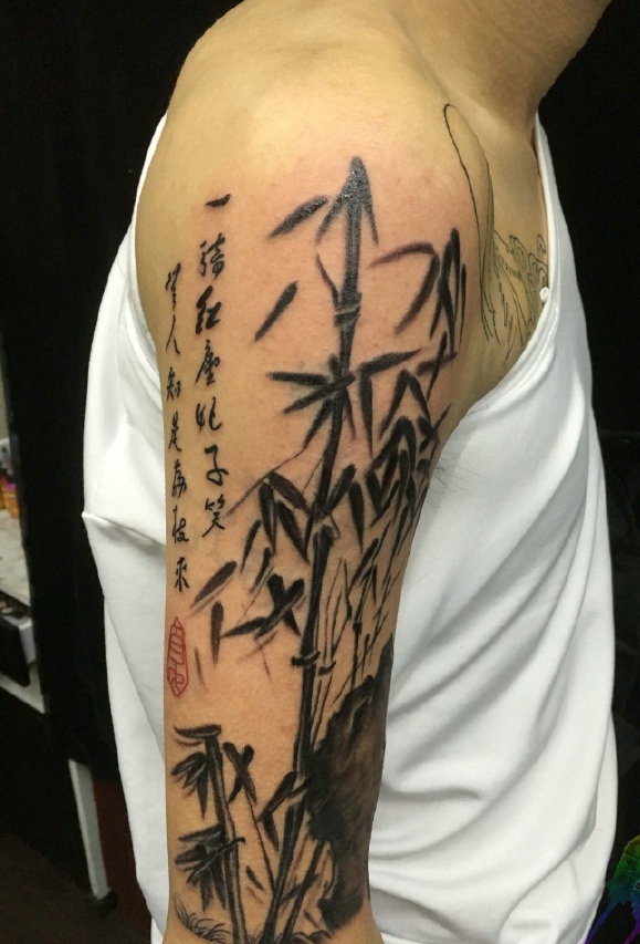 点击大图看下一张：山竹与汉字结合的大臂纹身图片(3/3)