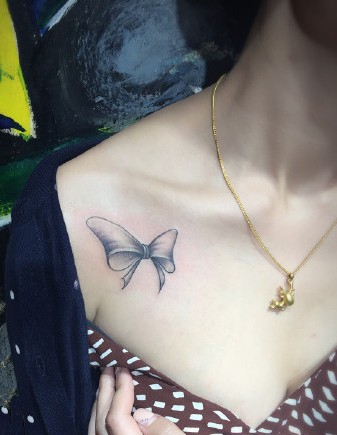 点击大图看下一张:俏皮可爱的蝴蝶结纹身图案