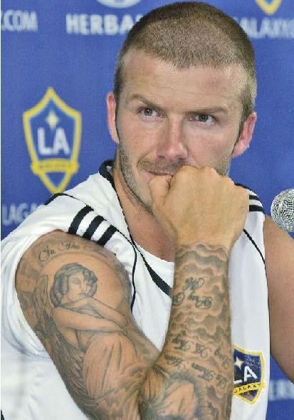 点击大图看下一张:万人迷贝克汉姆的时尚纹身