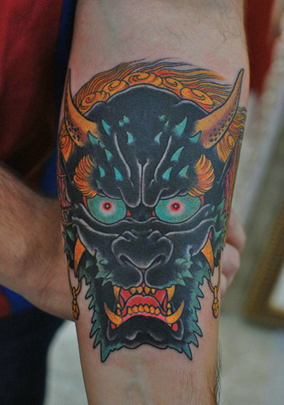 点击大图看下一张：手臂上的凶恶夜叉纹身