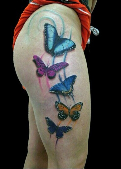 点击大图看下一张：大腿时尚漂亮的彩色蝴蝶纹身