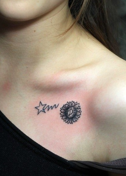 点击大图看下一张：锁骨上星星向日葵纹身