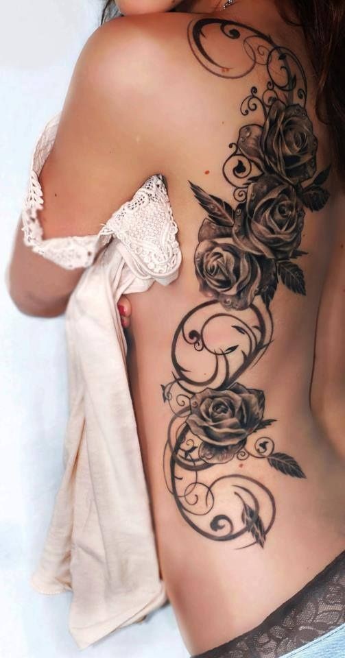 点击大图看下一张：美女侧背漂亮的玫瑰和蔓藤纹身