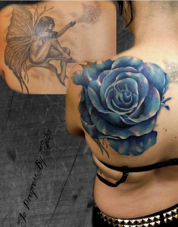 点击大图看下一张：女性背部遮盖效果的玫瑰纹身