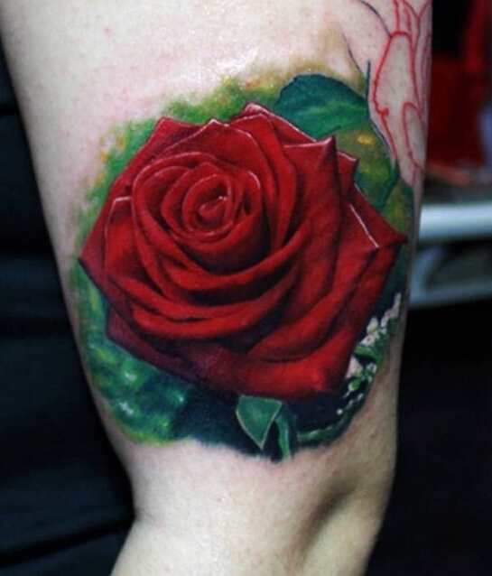 点击大图看下一张：手臂上娇艳的玫瑰纹身