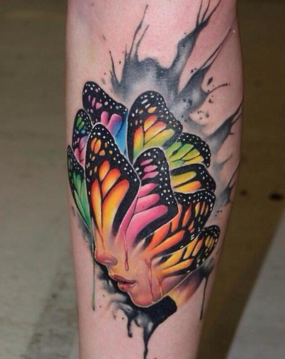 点击大图看下一张：小腿彩色个性蝴蝶女郎纹身图案