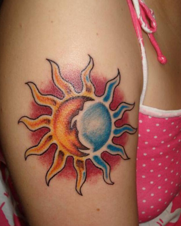 点击大图看下一张：女生手臂个性的太阳纹身
