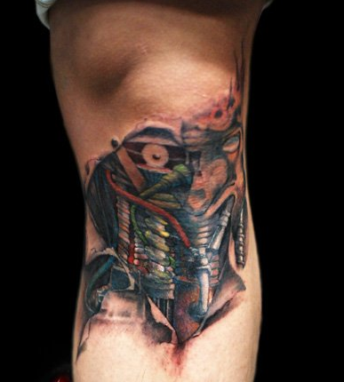 点击大图看下一张：膝盖蒸汽机机械纹身图案