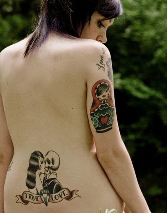 点击大图看下一张：女性腰部个性纹身图案