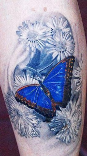 腿部彩色3D蝴蝶花卉纹身图片