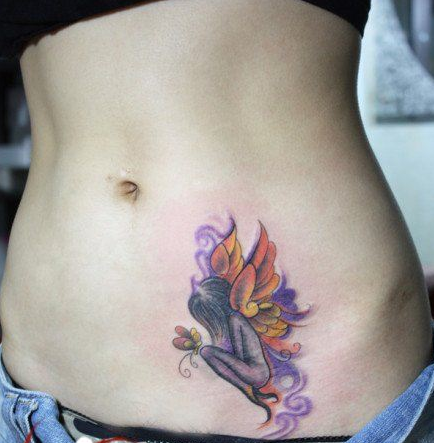 点击大图看下一张：美女腹部好看的小天使纹身图案