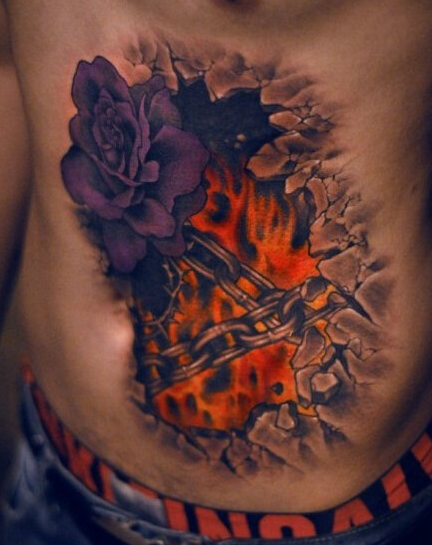 点击大图看下一张：腹部彩色地裂火焰玫瑰花纹身图片