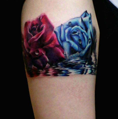 点击大图看下一张：手臂漂亮的玫瑰花纹身图案