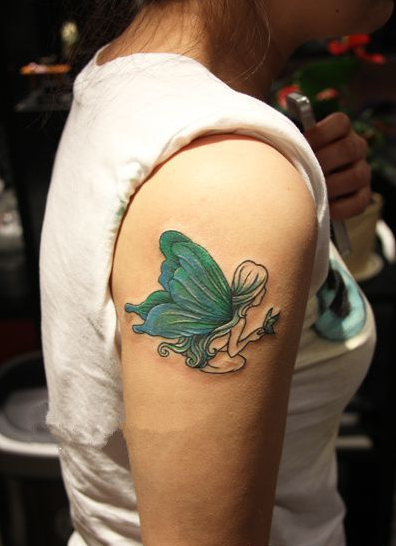 点击大图看下一张：蝴蝶精灵手臂刺青作品