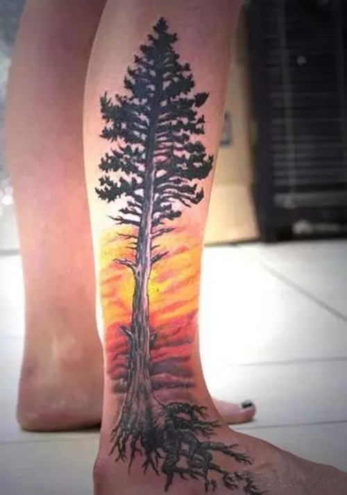 点击大图看下一张：小腿好看的夕阳和树纹身图案