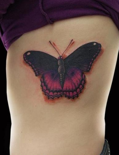 点击大图看下一张：炫彩蝴蝶纹身图片