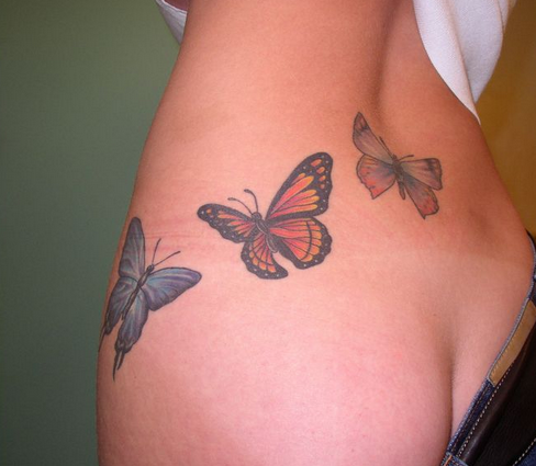 点击大图看下一张：性感腰部蝴蝶纹身图案