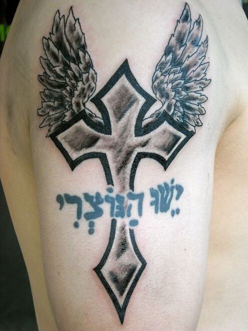 点击大图看下一张：手臂好看的翅膀十字架纹身