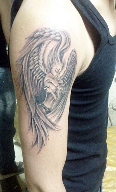 点击大图看下一张：手臂好看的天使纹身
